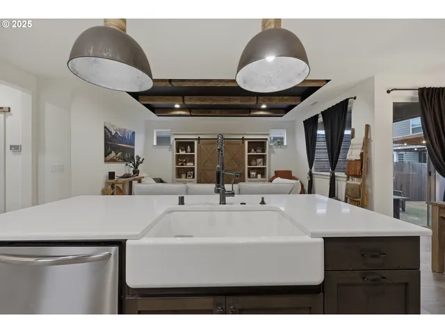 a kitchen with a stove and a sink