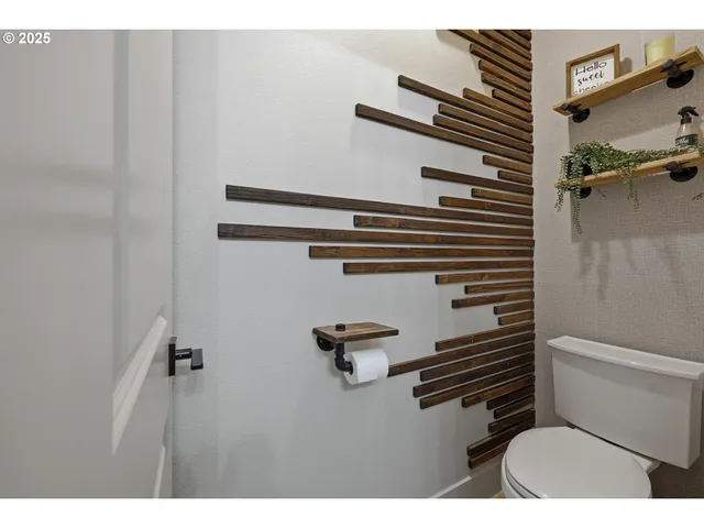 a bathroom with a toilet and a sink