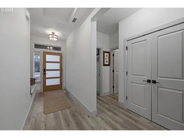 a view of hallway with wooden floor
