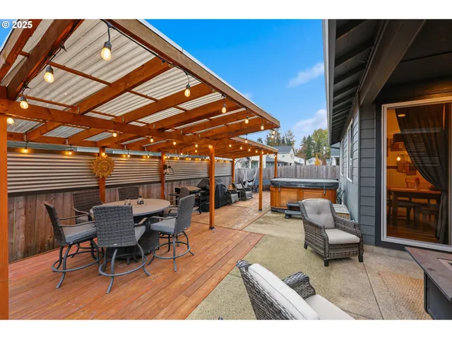 a outdoor living space with furniture and a fireplace