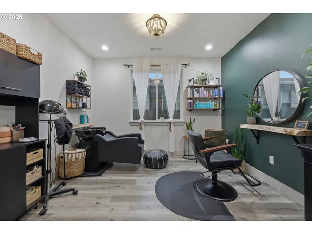 a living room with furniture and a piano
