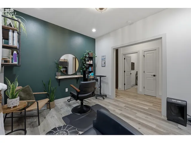 a living room with furniture a piano and a bookshelf