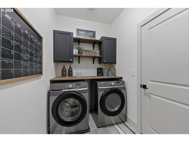 a view of washer and dryer in a utility room