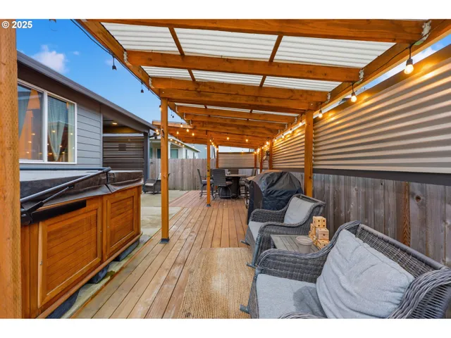 a view of living room with furniture and wooden floor