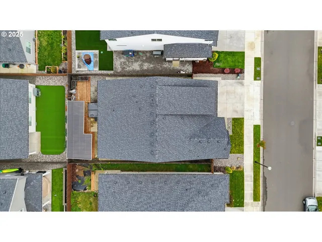 a aerial view of a house with a yard