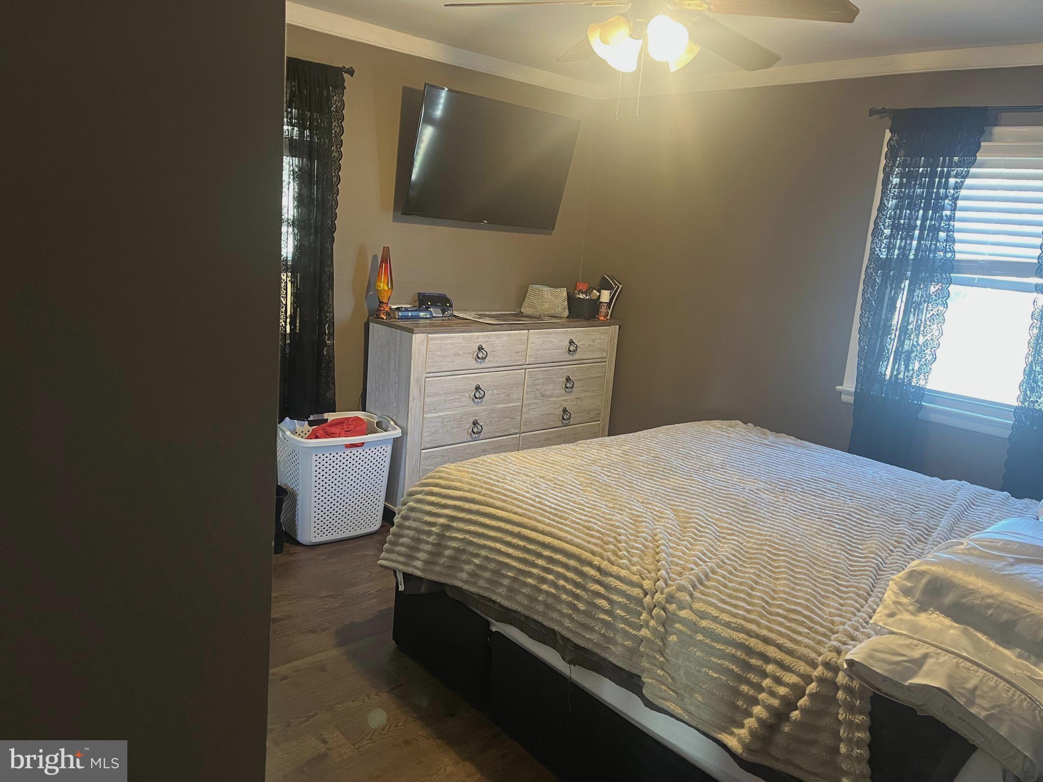 510 Johnson Place Magnolia, NJ 08049 - Photo 11 of 42 a bedroom with a bed and a mirror on dresser