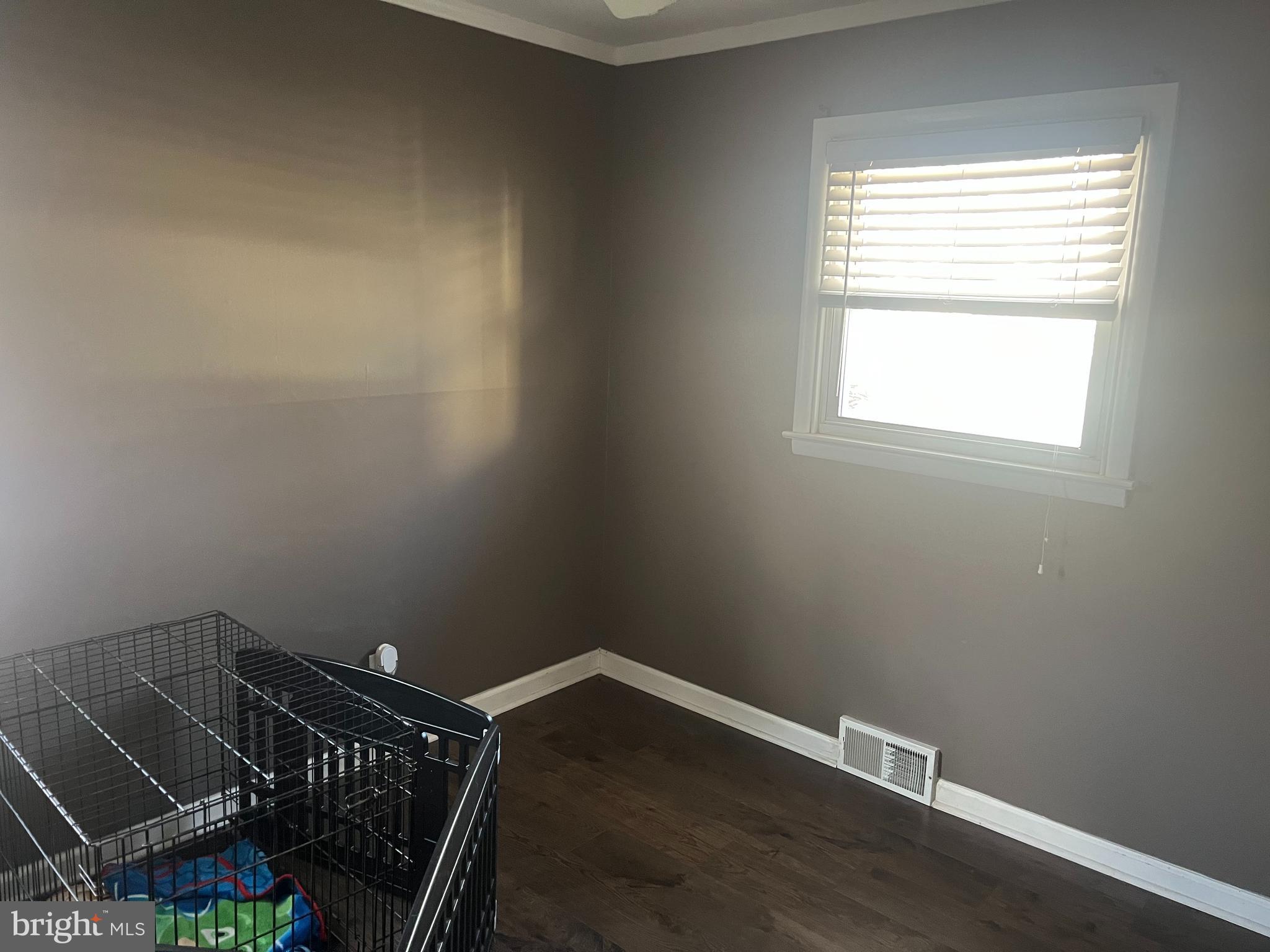 510 Johnson Place Magnolia, NJ 08049 - Photo 12 of 42 an empty room with wooden floor and windows