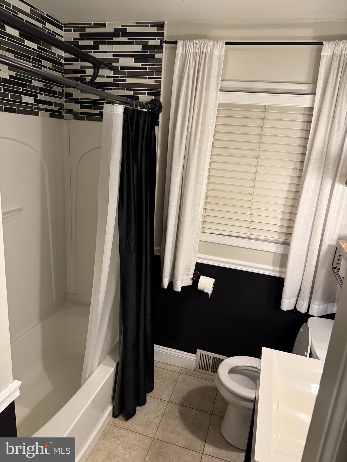 510 Johnson Place Magnolia, NJ 08049 - Photo 14 of 42 a bathroom with a bathtub and shower