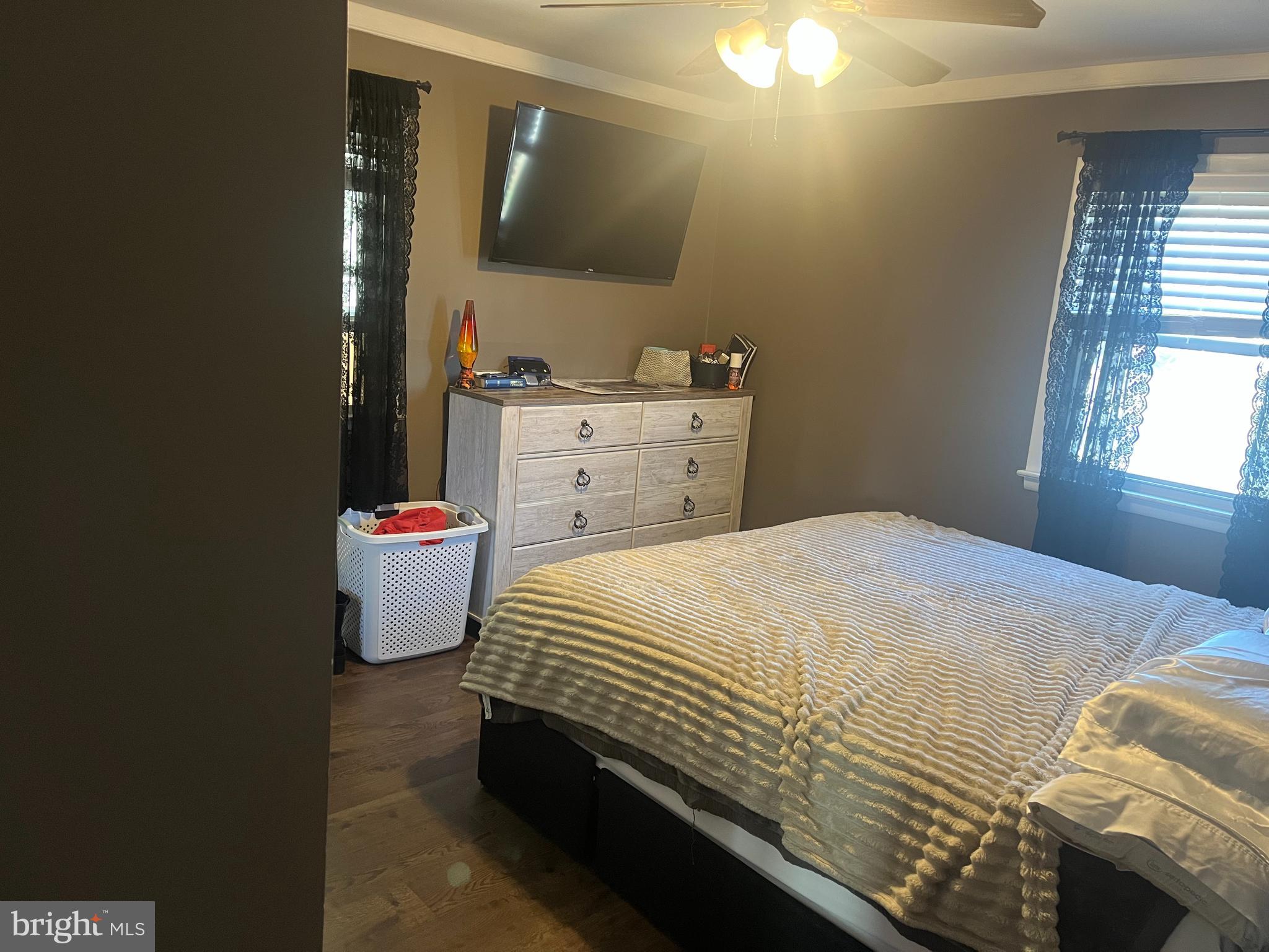 510 Johnson Place Magnolia, NJ 08049 - Photo 17 of 42 a bed sitting in a bedroom next to a window