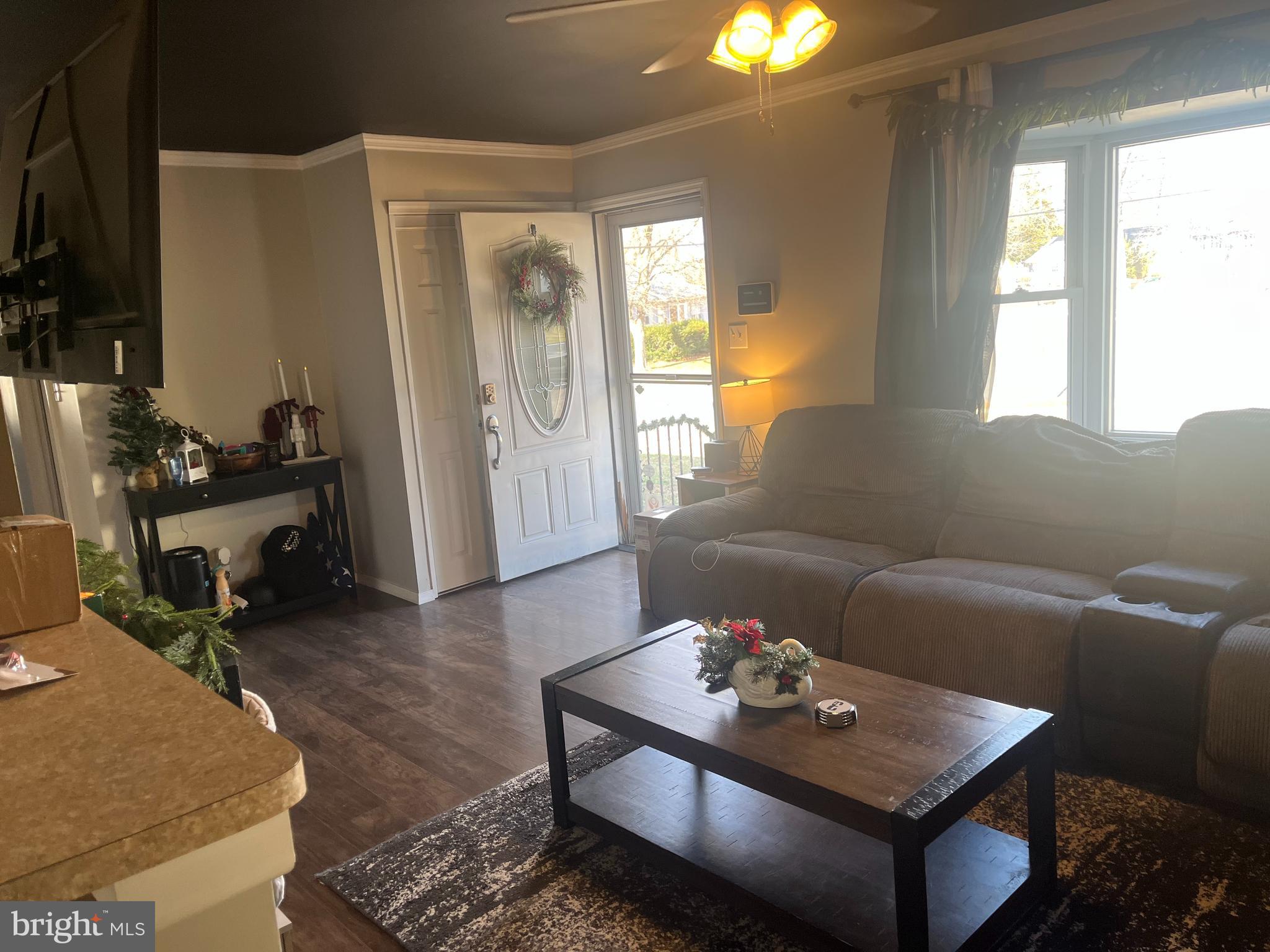 510 Johnson Place Magnolia, NJ 08049 - Photo 18 of 42 a living room with furniture and a chandelier