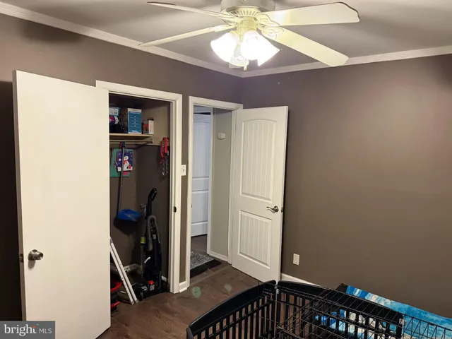 a bedroom with a bed and a television