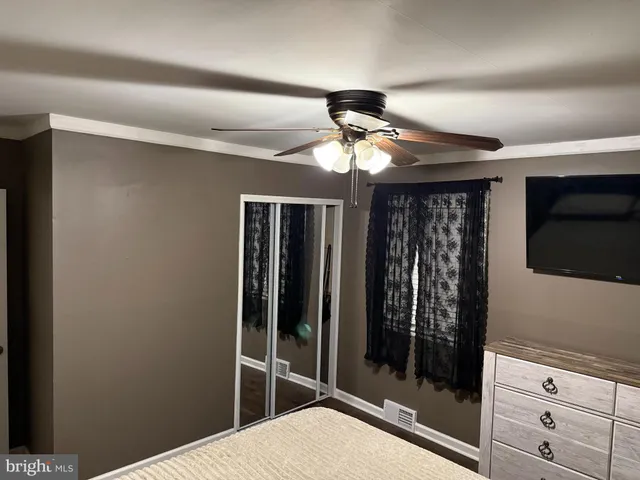 a view of a livingroom with a glass door and furniture