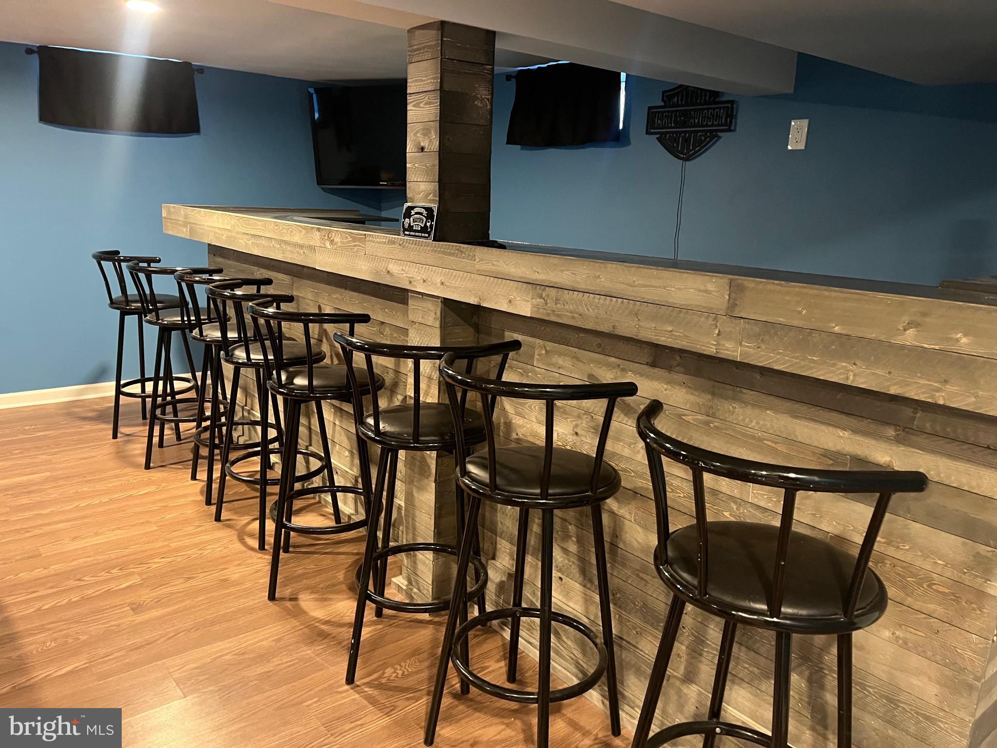 510 Johnson Place Magnolia, NJ 08049 - Photo 33 of 42 a kitchen with a table chairs and a refrigerator