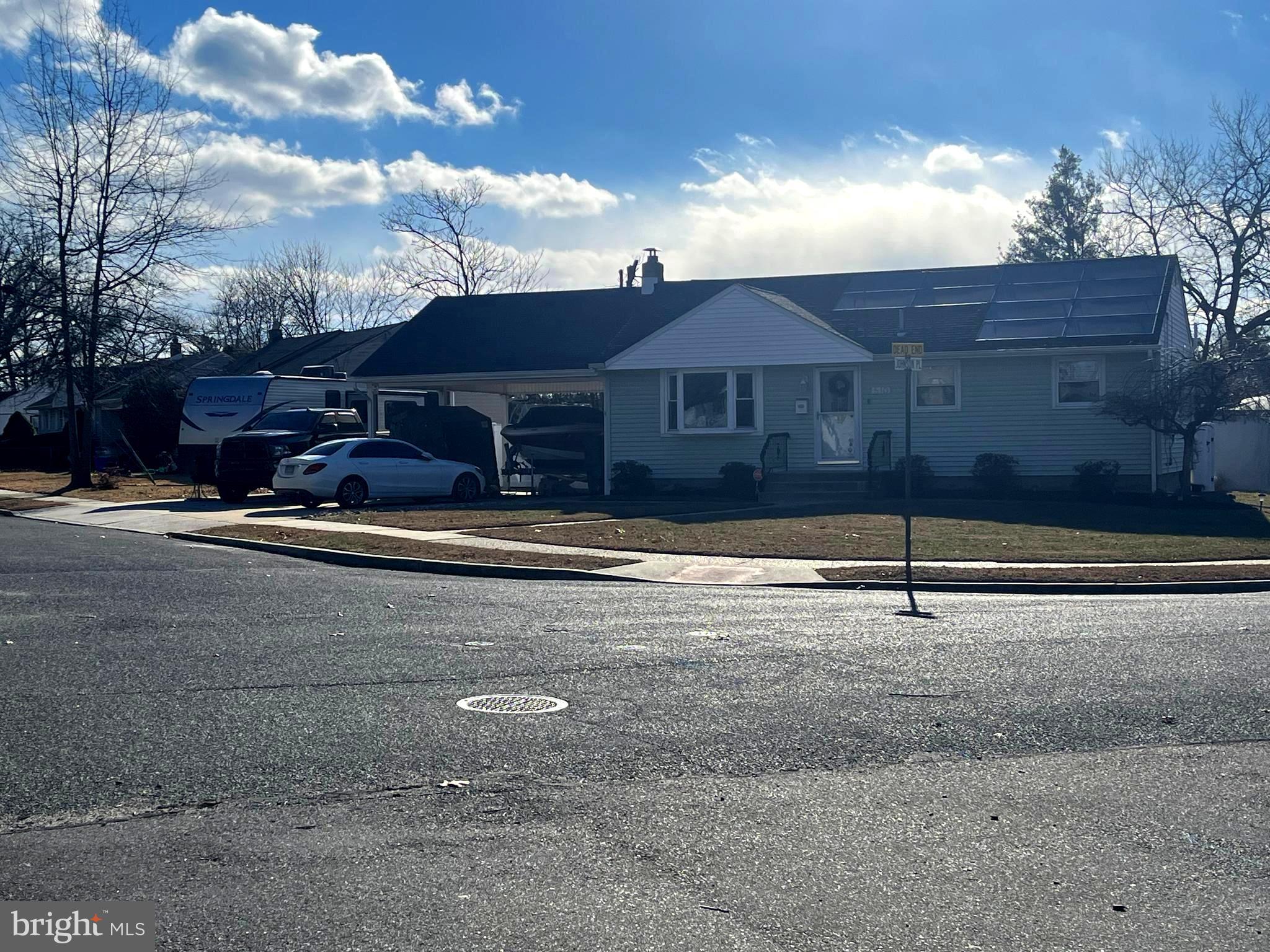 510 Johnson Place Magnolia, NJ 08049 - Photo 4 of 42 a front view of a house with a yard
