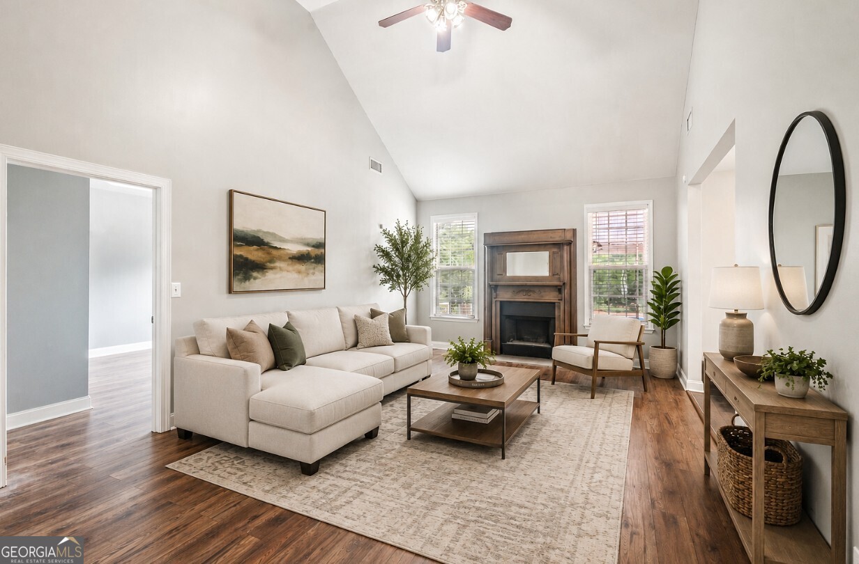 82 Newton Road LaGrange, GA 30240 - Photo 7 of 45 a living room with furniture a fireplace and a potted plant