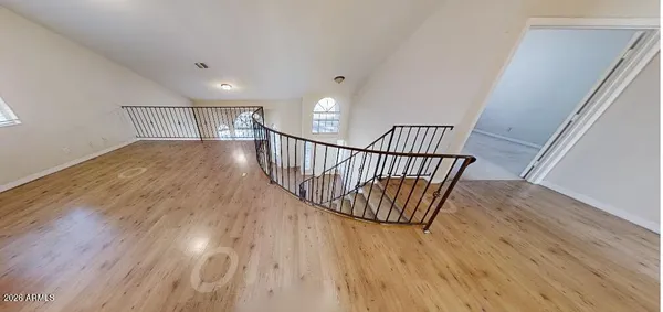 a view of staircase with wooden floor and stairs