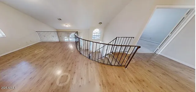 a view of staircase with wooden floor and stairs