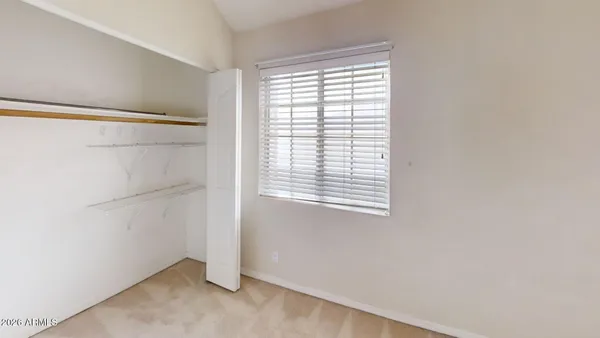 a view of a room that has a window in it