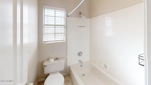 a bathroom with a toilet a sink and a bathtub
