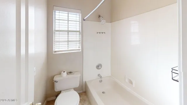 a bathroom with a toilet a sink and a bathtub