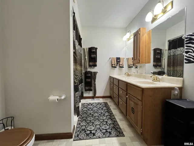 a bedroom with furniture and a chandelier