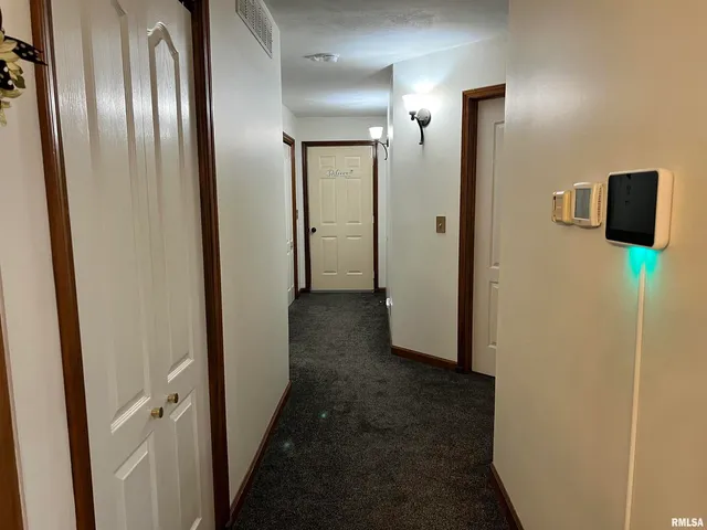 a bedroom with furniture and a large window