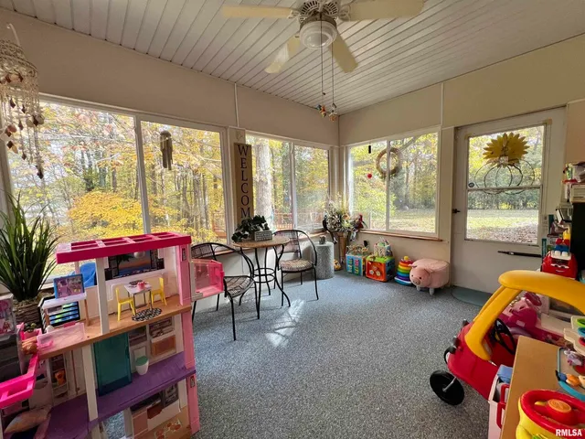 a view of a chairs and table in the balcony