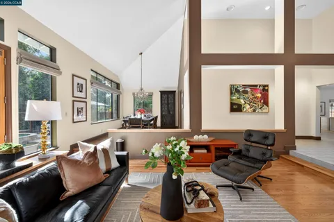 a living room with furniture and a lamp