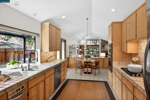 a very nice looking kitchen with a large window