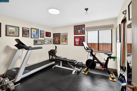 a kitchen with a sink a window and wooden cabinets