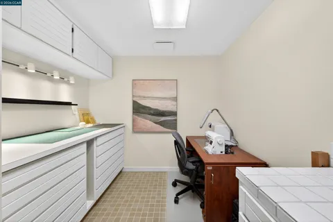 a view of a house with backyard swimming pool and sitting area