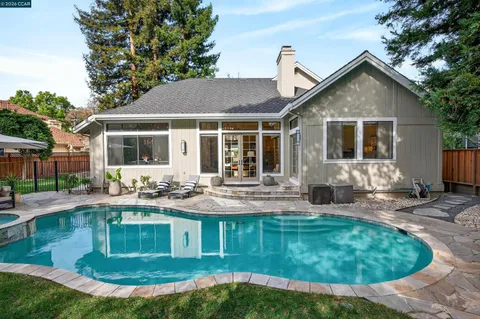 a view of a swimming pool with a patio