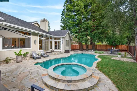 a view of a swimming pool with a patio