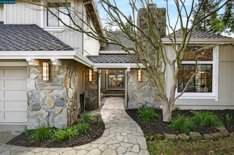 a front view of a house with garden