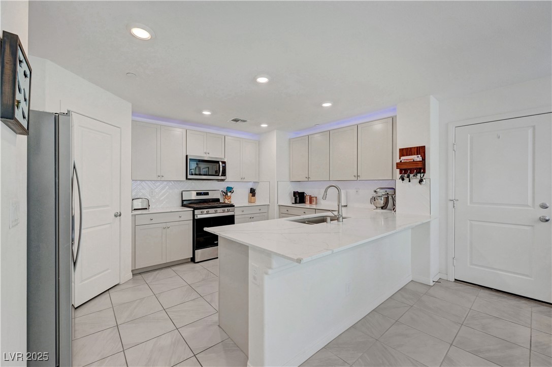 3637 Modico Lane Henderson, NV 89044 - Photo 23 of 62 Kitchen featuring appliances with stainless steel