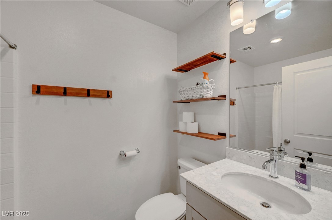 3637 Modico Lane Henderson, NV 89044 - Photo 38 of 62 Bathroom featuring vanity and a shower with curtai