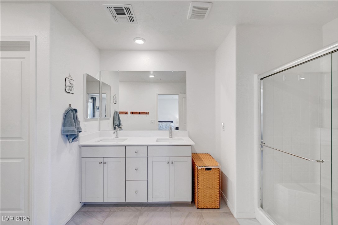 3637 Modico Lane Henderson, NV 89044 - Photo 43 of 62 Full bath with double vanity, a shower stall, and