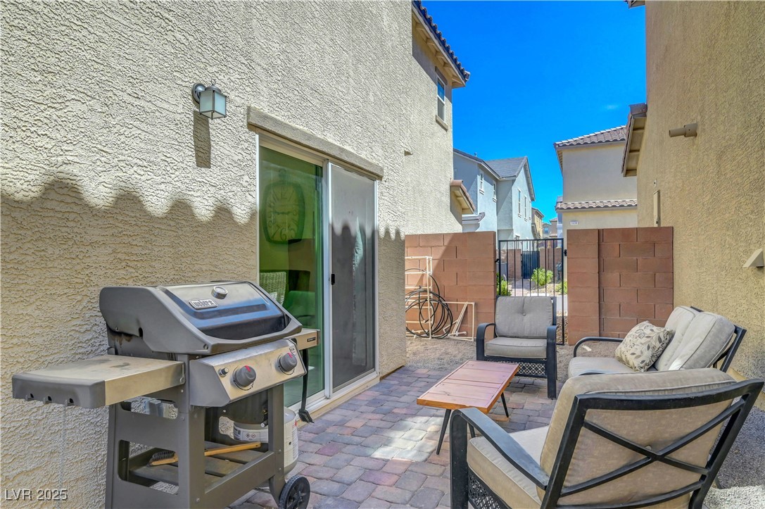 3637 Modico Lane Henderson, NV 89044 - Photo 55 of 62 View of patio / terrace with a gate, a grill, and