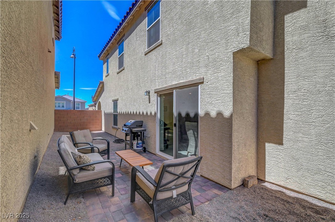 3637 Modico Lane Henderson, NV 89044 - Photo 56 of 62 Fenced backyard with a grill and a patio