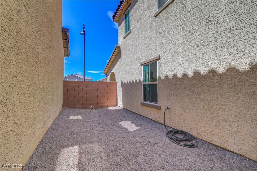 3637 Modico Lane Henderson, NV 89044 - Photo 57 of 62 View of property exterior with stucco siding