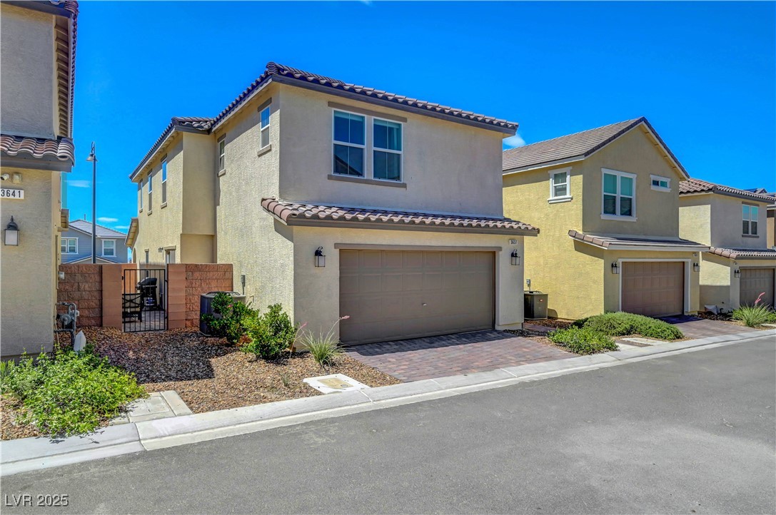 3637 Modico Lane Henderson, NV 89044 - Photo 62 of 62 Mediterranean / spanish house featuring a garage,