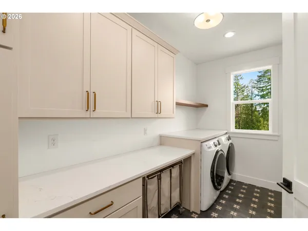 a kitchen with a sink a stove and cabinets