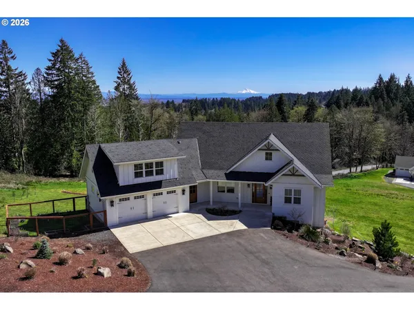 a aerial view of a house with a big yard