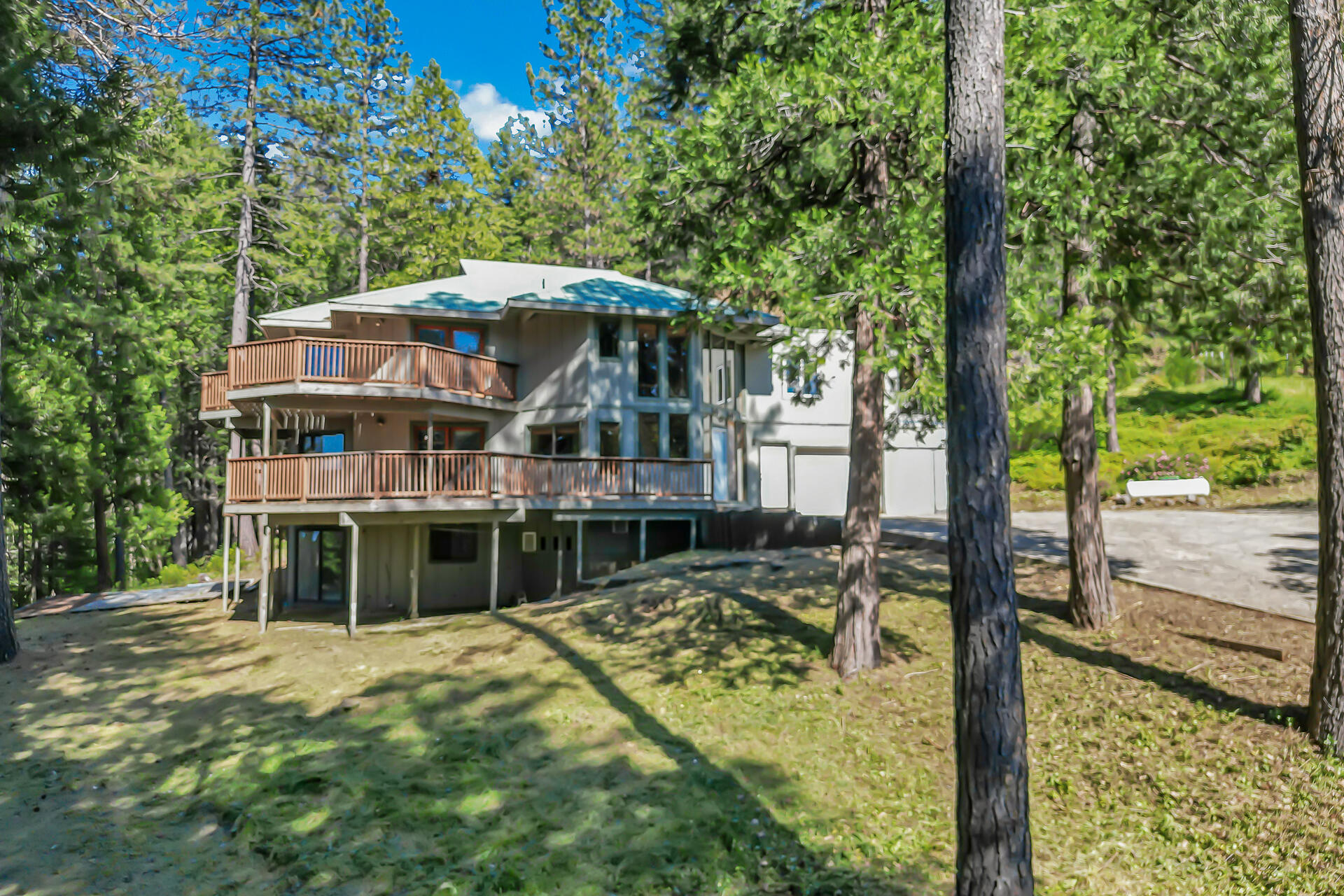 15368 Star Flower Road Oak Run, CA 96069 - Photo 6 of 63 a house with trees in front of it