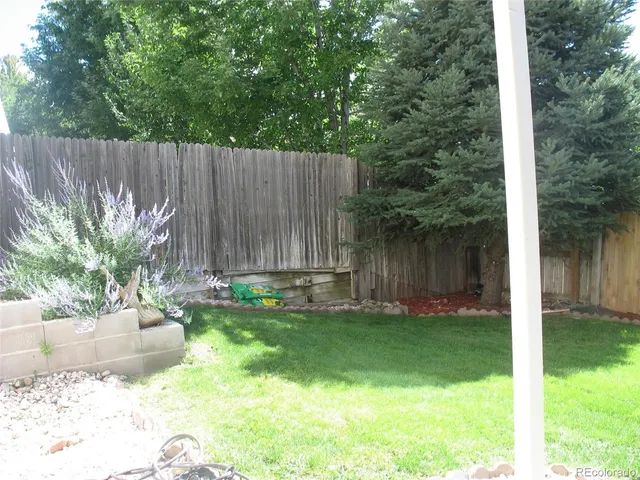 a view of a backyard with a garden and plants