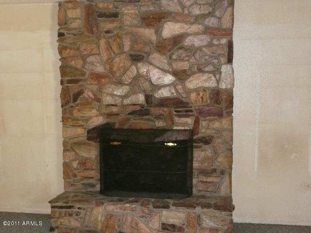 4739 West Carver Road Laveen, AZ 85339 - Photo 8 of 9 Stone fireplace