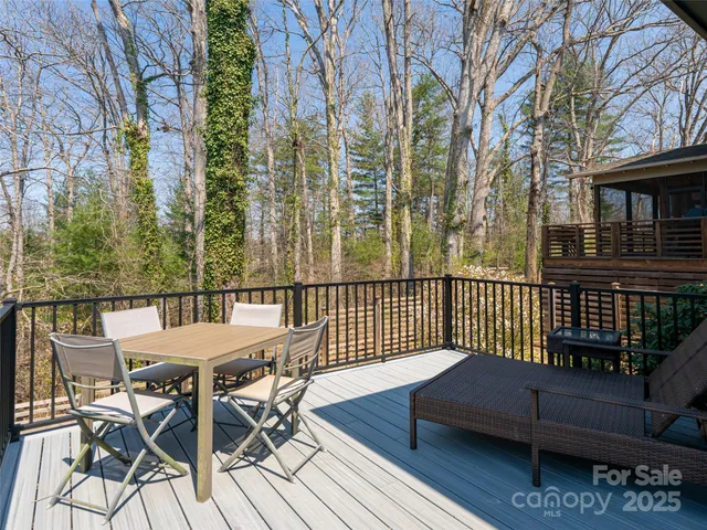 a view of hallway with wooden floor and front door