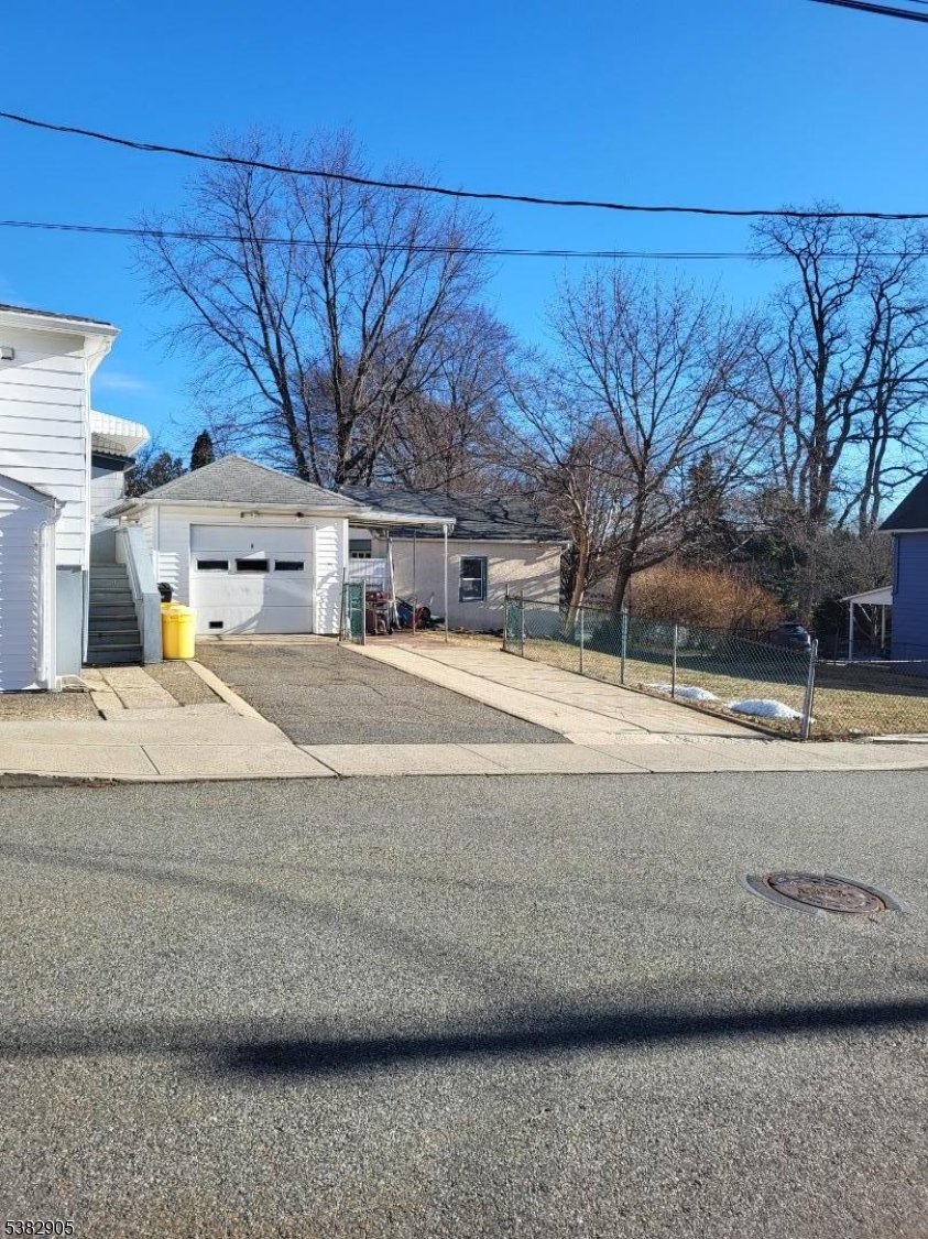 56 Maple Avenue, Unit 2 Rockaway, NJ 07866 - Photo 2 of 8 a view of road with a building