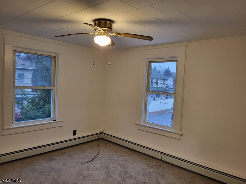 56 Maple Avenue, Unit 2 Rockaway, NJ 07866 - Photo 5 of 8 a view of an empty room with a window