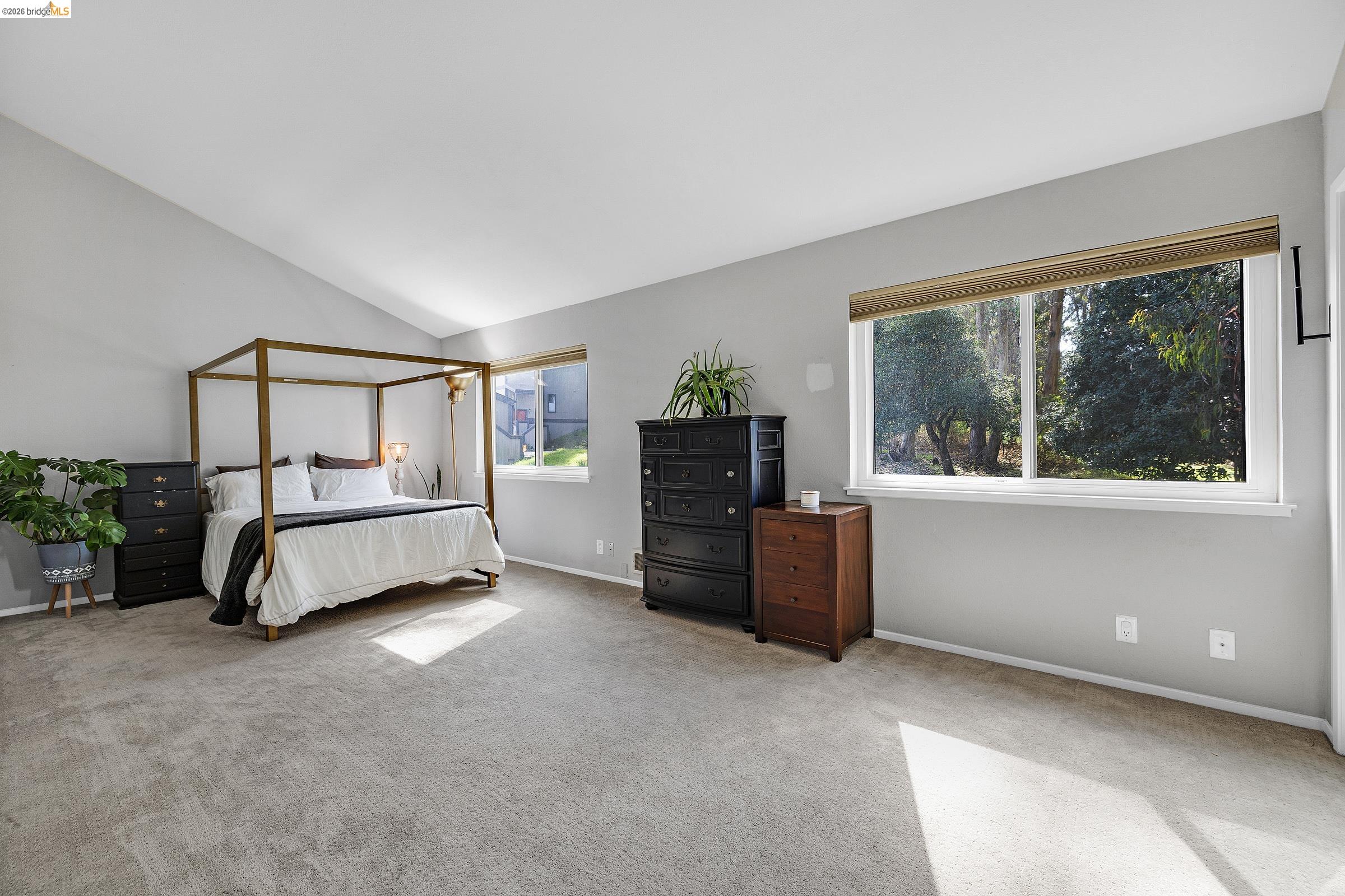 407 Vista Heights Road El Cerrito, CA 94530 - Photo 15 of 29 Carpeted bedroom with baseboards and lofted ceiling